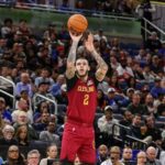 Jan 24, 2026; Orlando, Florida, USA; Cleveland Cavaliers guard Lonzo Ball (2) shoots a three point basket during the second half against the Orlando Magic at Kia Center. Mandatory Credit: Mike Watters-Imagn Images
