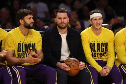 Feb 9, 2026; Los Angeles, California, USA; Los Angeles Lakers guard Luka Doncic (middle) watches a game against the Oklahoma City Thunder at Crypto.com Arena. Mandatory Credit: Kiyoshi Mio-Imagn Images