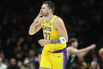 Feb 3, 2026; Brooklyn, New York, USA; Los Angeles Lakers guard Luka Doncic (77) gestures after scoring in the first quarter against the Brooklyn Nets at Barclays Center. Mandatory Credit: Wendell Cruz-Imagn Images