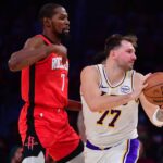 Los Angeles Lakers guard Luka Doncic (77) controls the ball against Houston Rockets forward Kevin Durant (7) during the second half at Crypto.com Arena.