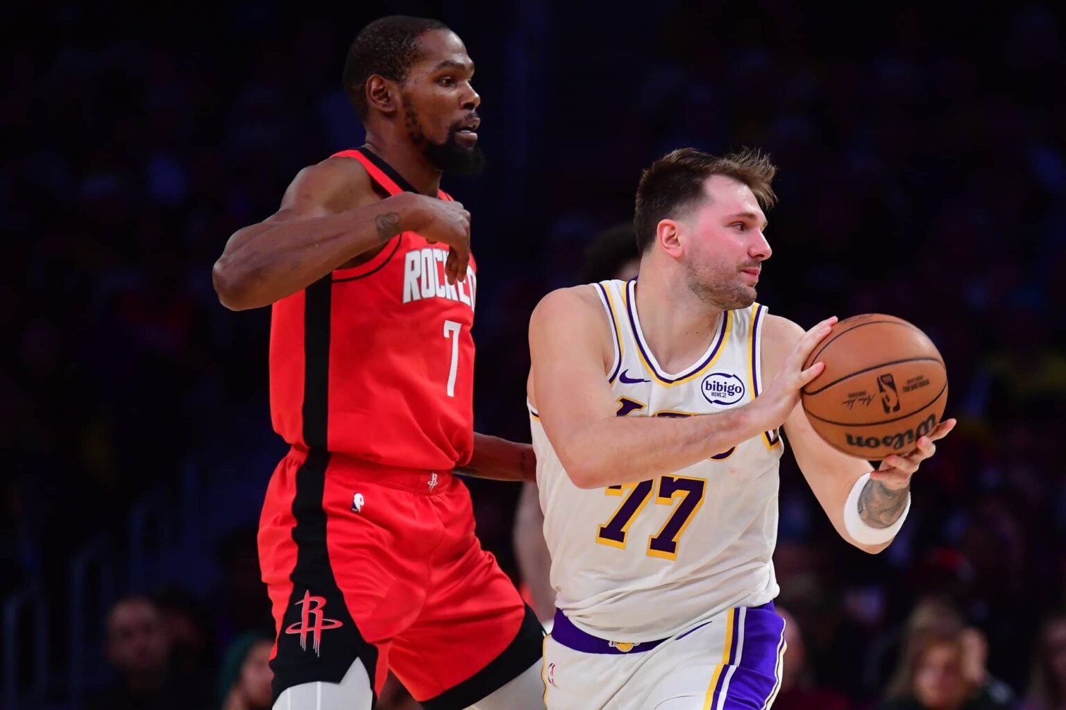 Los Angeles Lakers guard Luka Doncic (77) controls the ball against Houston Rockets forward Kevin Durant (7) during the second half at Crypto.com Arena.