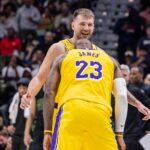 Jan 6, 2026; New Orleans, Louisiana, USA; Los Angeles Lakers forward LeBron James (23) jokes with forward/guard Luka Doncic (77) after a shot against the New Orleans Pelicans during the second half at Smoothie King Center. Mandatory Credit: Stephen Lew-Imagn Images