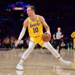 Los Angeles Lakers guard Luke Kennard (10) controls the ball against the Golden State Warriors during the first half at Crypto.com Arena.