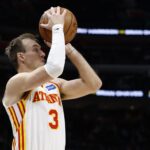 Dec 1, 2025; Detroit, Michigan, USA; Atlanta Hawks guard Luke Kennard (3) shoots in the first half against the Detroit Pistons at Little Caesars Arena. Mandatory Credit: Rick Osentoski-Imagn Images