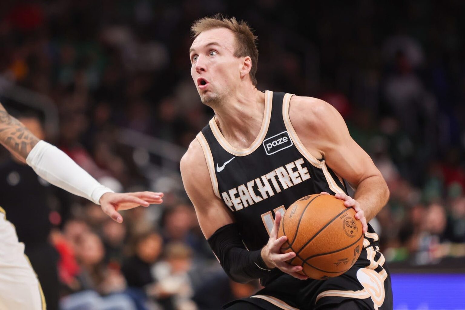 Jan 17, 2026; Atlanta, Georgia, USA; Atlanta Hawks guard Luke Kennard (4) shoots against the Boston Celtics in the first quarter at State Farm Arena. Mandatory Credit: Brett Davis-Imagn Images