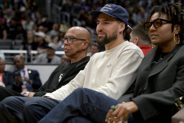 Former NBA player Mychal Thompson and his son Golden State Warriors Klay Thompson attend the game between the Los Angeles Sparks and the Indiana Fever at Crypto.com Arena.