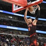 Jan 20, 2026; Chicago, Illinois, USA; Chicago Bulls center Nikola Vucevic (9) dunks the ball against the LA Clippers during the second half at United Center. Mandatory Credit: Matt Marton-Imagn Images