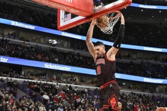 Jan 20, 2026; Chicago, Illinois, USA; Chicago Bulls center Nikola Vucevic (9) dunks the ball against the LA Clippers during the second half at United Center. Mandatory Credit: Matt Marton-Imagn Images