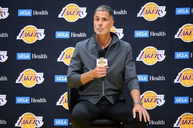 Sep 25, 2025; El Segundo, CA, USA; Los Angeles Lakers general manager Rob Pelinka, left, speaks during a press conference to preview the 2025-26 season at UCLA Health Training Center. Mandatory Credit: William Liang-Imagn Images