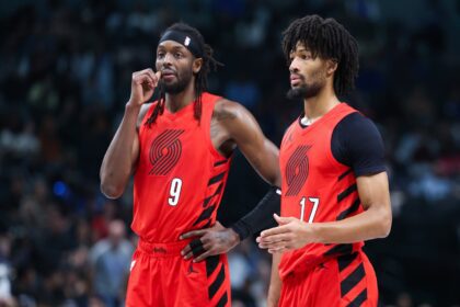 Nov 16, 2025; Dallas, Texas, USA; Portland Trail Blazers forward Jerami Grant (9) and Portland Trail Blazers guard Shaedon Sharpe (17) chat during the second quarter against the Dallas Mavericks at American Airlines Center. Mandatory Credit: Kevin Jairaj-Imagn Images