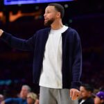 Feb 7, 2026; Los Angeles, California, USA; Golden State Warriors guard Stephen Curry (30) watches game action during the second half at Crypto.com Arena. Mandatory Credit: Gary A. Vasquez-Imagn Images