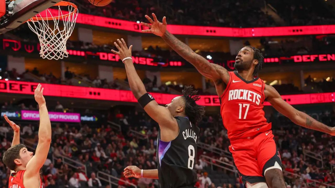 Feb 23, 2026; Houston, Texas, USA; Utah Jazz guard Isaiah Collier (8) shoots against Houston Rockets forward Tari Eason (17) in the second quarter at Toyota Center. Mandatory Credit: Thomas Shea-Imagn Images