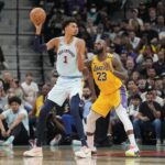 Nov 27, 2024; San Antonio, Texas, USA; San Antonio Spurs center Victor Wembanyama (1) handles the ball in front of Los Angeles Lakers forward LeBron James (23) in the second half at Frost Bank Center. Mandatory Credit: Daniel Dunn-Imagn Images