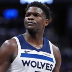 Denver, Colorado, USA; Minnesota Timberwolves guard Anthony Edwards (5) reacts against the Denver Nuggets during the first half at Ball Arena. Mandatory Credit: Ron Chenoy-Imagn Images