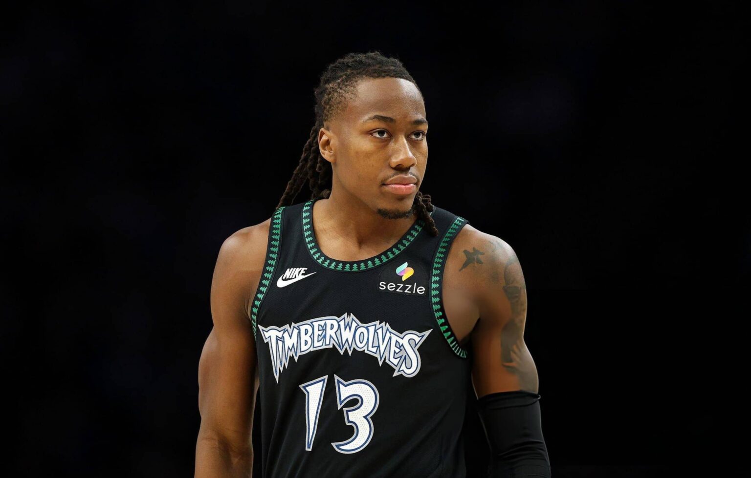MINNEAPOLIS, MINNESOTA - FEBRUARY 09: Ayo Dosunmu #13 of the Minnesota Timberwolves looks on against the Atlanta Hawks in the first quarter at Target Center on February 09, 2026 in Minneapolis, Minnesota. (Photo by David Berding/Getty Images)