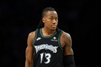 MINNEAPOLIS, MINNESOTA - FEBRUARY 09: Ayo Dosunmu #13 of the Minnesota Timberwolves looks on against the Atlanta Hawks in the first quarter at Target Center on February 09, 2026 in Minneapolis, Minnesota. (Photo by David Berding/Getty Images)
