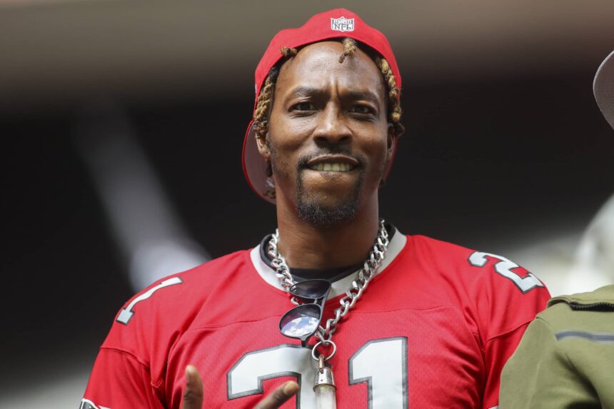 Atlanta, Georgia, USA; NBA player Dwight Howard watches a game between the Atlanta Falcons and Los Angeles Chargers in the second half at Mercedes-Benz Stadium. Mandatory Credit: Brett Davis-Imagn Images