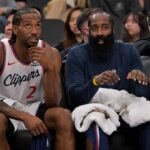 Inglewood, California, USA; Los Angeles Clippers forward Kawhi Leonard (2)and Los Angeles Clippers guard James Harden (1) sit on the bench in the fourth quarter against the Sacramento Kings at Intuit Dome. Mandatory Credit: Jayne Kamin-Oncea-Imagn Images