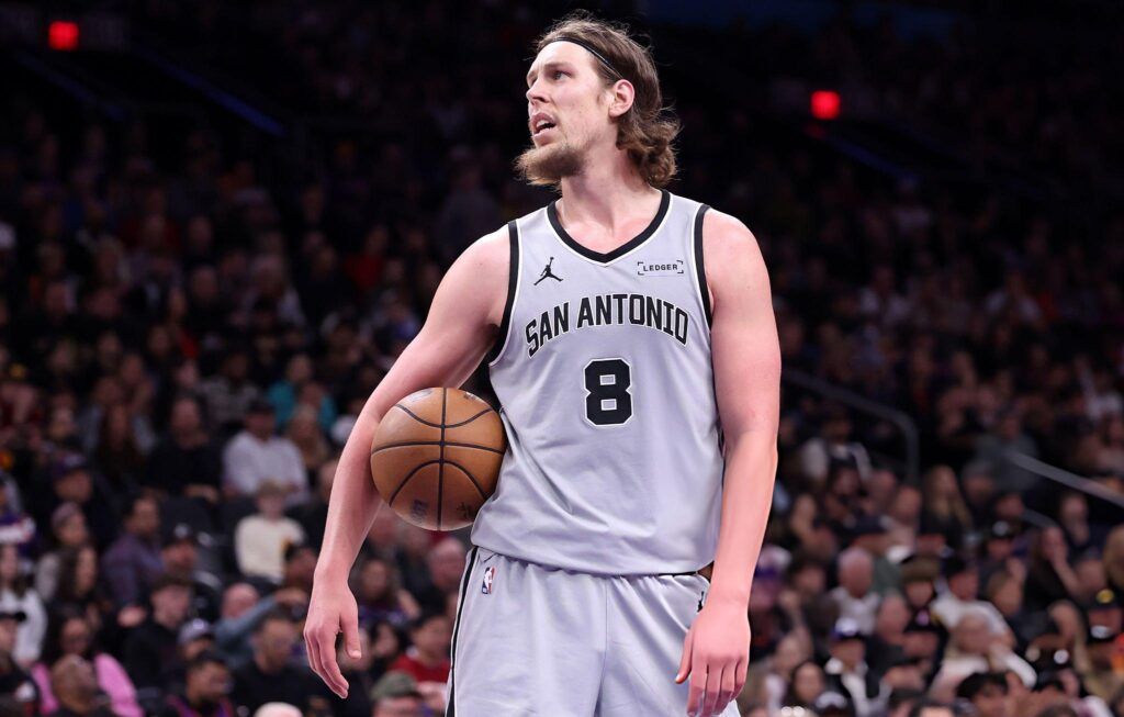 PHOENIX, ARIZONA - NOVEMBER 23: Kelly Olynyk #8 of the San Antonio Spurs holds the ball during the second half against the Phoenix Suns at Mortgage Matchup Center on November 23, 2025 in Phoenix, Arizona. The Suns defeated the Spurs 111-102. NOTE TO USER: User expressly acknowledges and agrees that, by downloading and or using this photograph, User is consenting to the terms and conditions of the Getty Images License Agreement. (Photo by Chris Coduto/Getty Images)