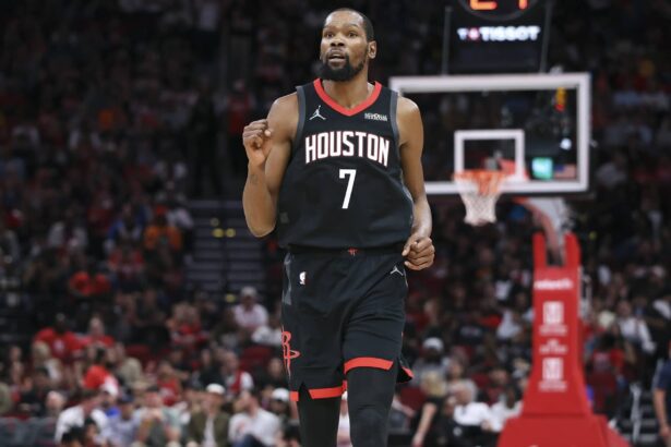 Houston, Texas, USA; Houston Rockets forward Kevin Durant (7) reacts after a play during the third quarter against the Cleveland Cavaliers at Toyota Center. Mandatory Credit: Troy Taormina-Imagn Images