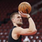Chicago, Illinois, USA; Atlanta Hawks center Kristaps Porzingis (8) warms up before an NBA game against the Chicago Bulls at United Center. Mandatory Credit: Kamil Krzaczynski-Imagn Images
