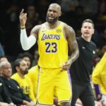 Los Angeles Lakers forward LeBron James (23) signals for a video review in the third quarter against the Brooklyn Nets
