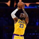 Los Angeles, California, USA; Los Angeles Lakers forward LeBron James (23) shoots against the Golden State Warriors during the first half at Crypto.com Arena. Mandatory Credit: Gary A. Vasquez-Imagn Images