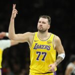 Brooklyn, New York, USA; Los Angeles Lakers guard Luka Doncic (77) gestures after scoring in the first quarter against the Brooklyn Nets at Barclays Center. Mandatory Credit: Wendell Cruz-Imagn Images