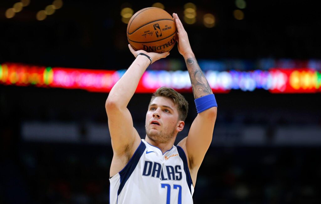 NEW ORLEANS, LOUISIANA - DECEMBER 28: Luka Doncic #77 of the Dallas Mavericks shoots the ball during a game against the New Orleans Pelicans at the Smoothie King Center on December 28, 2018 in New Orleans, Louisiana. NOTE TO USER: User expressly acknowledges and agrees that, by downloading and or using this photograph, User is consenting to the terms and conditions of the Getty Images License Agreement. (Photo by Jonathan Bachman/Getty Images)