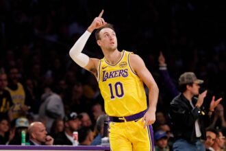 LOS ANGELES, CA - FEBRUARY 7, 2026: Los Angeles Lakers guard Luke Kennard (10) reacts after scoring on a three point shot, his first points in a Lakers uniform against the Golden State Warriors in the first half at Crypto.com Arena on February 7, 2026 in Los Angeles, California.(Gina Ferazzi / Los Angeles Times via Getty Images)