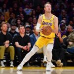 Los Angeles, California, USA; Los Angeles Lakers guard Luke Kennard (10) shoots against the Golden State Warriors during the first half at Crypto.com Arena. Mandatory Credit: Gary A. Vasquez-Imagn Images