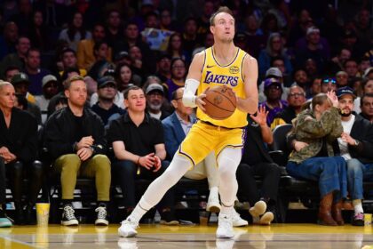 Los Angeles, California, USA; Los Angeles Lakers guard Luke Kennard (10) shoots against the Golden State Warriors during the first half at Crypto.com Arena. Mandatory Credit: Gary A. Vasquez-Imagn Images