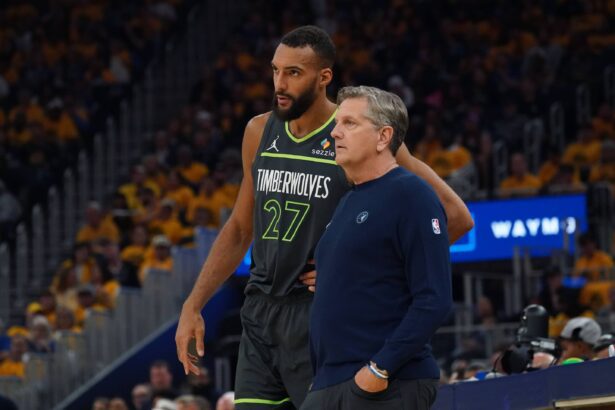 San Francisco, California, USA; Minnesota Timberwolves center Rudy Gobert (27) talks with Minnesota Timberwolves head coach Chris Finch in the second quarter against the Golden State Warriors during Game 3 in the second round of the 2025 NBA Playoffs at Chase Center. Mandatory Credit: David Gonzales-Imagn Images