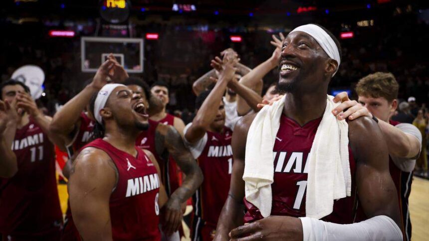 Miami Heat center Bam Adebayo (13) celebrates with teammates after scoring 83 points against the Washington Wizards, the second-highest single-game total in NBA history, Tuesday, March 10, 2026, at Kaseya Center in Miami. The Heat won 150-129. Alie Skowronski askowronski@miamiherald.com