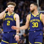 SAN FRANCISCO, CALIFORNIA - FEBRUARY 22: Stephen Curry #30 of the Golden State Warriors talks to teammate Brandin Podziemski #2 in the first half against the Los Angeles Lakers at Chase Center on February 22, 2024 in San Francisco, California. NOTE TO USER: User expressly acknowledges and agrees that, by downloading and or using this photograph, User is consenting to the terms and conditions of the Getty Images License Agreement. (Photo by Lachlan Cunningham/Getty Images)