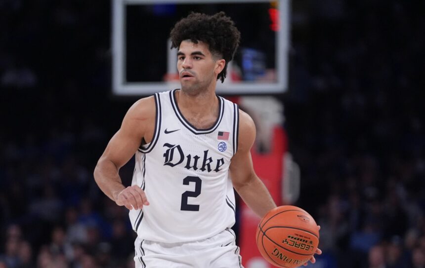 Cayden Boozer looks to pass the ball during a game. Mandatory Credit: AP Photo - Frank Franklin II