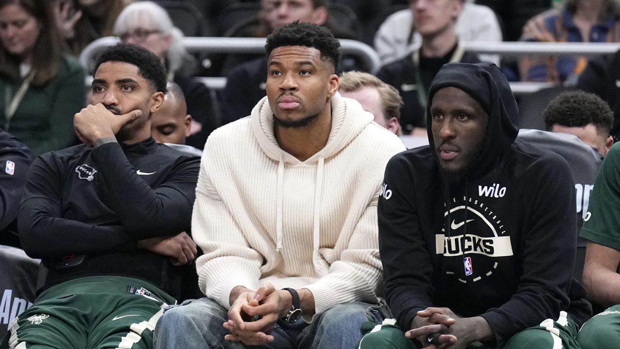 Mar 17, 2026; Milwaukee, Wisconsin, USA; Milwaukee Bucks guard Gary Harris (11), left, Milwaukee Bucks forward Giannis Antetokounmpo (34) and Milwaukee Bucks forward Taurean Prince (12) watch the game against the Cleveland Cavaliers from the bench in the second half at Fiserv Forum. Mandatory Credit: Michael McLoone-Imagn Images