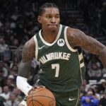 Oct 22, 2025; Milwaukee, Wisconsin, USA; Milwaukee Bucks guard Kevin Porter Jr. (7) drives to the basket against the Washington Wizards in the first half at Fiserv Forum. Mandatory Credit: Michael McLoone-Imagn Images