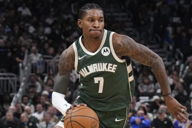 Oct 22, 2025; Milwaukee, Wisconsin, USA; Milwaukee Bucks guard Kevin Porter Jr. (7) drives to the basket against the Washington Wizards in the first half at Fiserv Forum. Mandatory Credit: Michael McLoone-Imagn Images