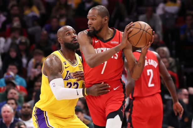 Mar 16, 2026; Houston, Texas, USA; Los Angeles Lakers forward LeBron James (23) defends against Houston Rockets forward Kevin Durant (7) during the fourth quarter at Toyota Center. Mandatory Credit: Troy Taormina-Imagn Images