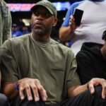 Apr 27, 2024; Orlando, Florida, USA; Orlando Magic former guard Tracy McGrady looks on from the sidelines during a game against the Cleveland Cavaliers in the fourth quarter during game four of the first round for the 2024 NBA playoffs at Kia Center. Mandatory Credit: Nathan Ray Seebeck-Imagn Images
