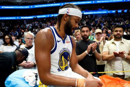 Mar 23, 2026; Dallas, Texas, USA; Golden State Warriors guard Moses Moody (4) leaves the court on a stretcher during overtime against the Dallas Mavericks at American Airlines Center. Mandatory Credit: Kevin Jairaj-Imagn Images