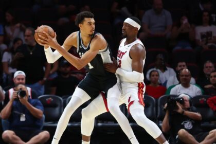 MIAMI, FLORIDA – OCTOBER 15: Victor Wembanyama #1 of the San Antonio Spurs drives against Bam Adebayo #13 of the Miami Heat during the first quarter of a preseason game at Kaseya Center on October 15, 2024 in Miami, Florida. | Credit: Megan Briggs/Getty Images