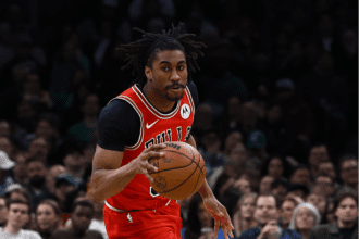 Chicago Bulls guard Jaden Ivey (31) brings the ball up the court against the Boston Celtics during the second half at TD Garden.