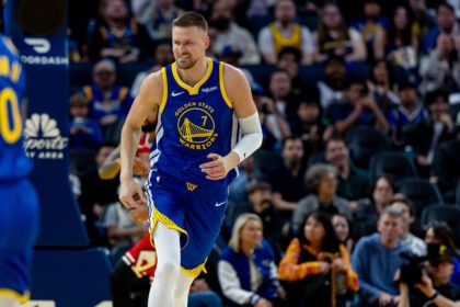 Golden State Warriors center Kristaps Porzingis (7) celebrates during the third quarter against the Chicago Bulls at Chase Center.