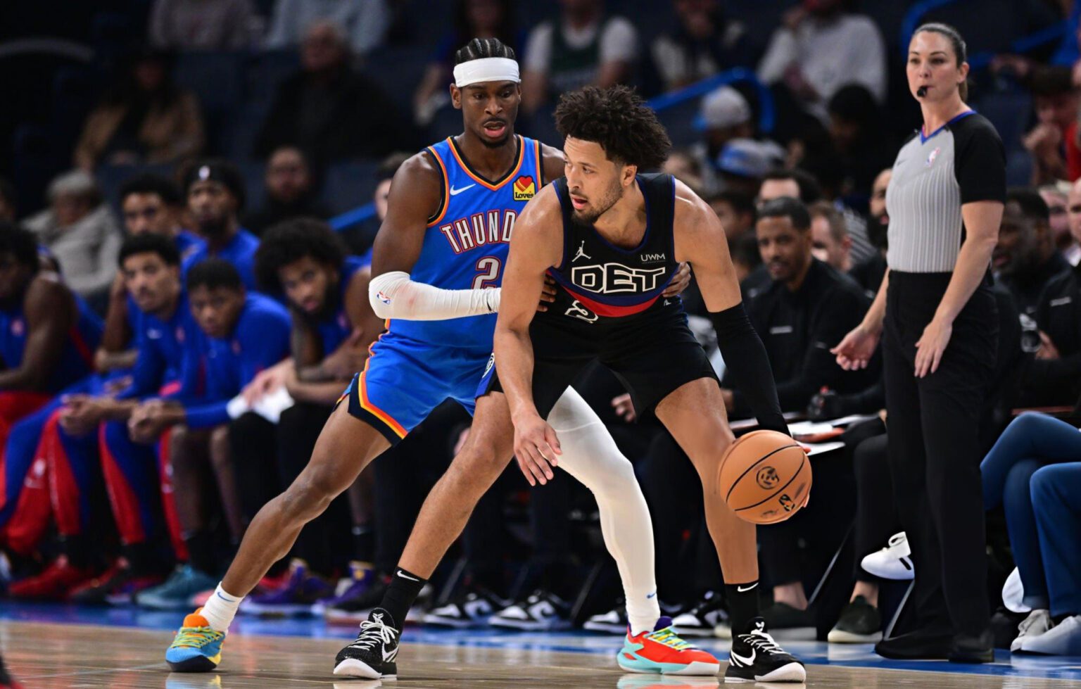 OKLAHOMA CITY, OKLAHOMA - OCTOBER 30: Cade Cunningham #2 of the Detroit Pistons handles the ball while being defended by Shai Gilgeous-Alexander #2 of the Oklahoma City Thunder at Paycom Center on October 30, 2023 in Oklahoma City, Oklahoma. (Photo by Joshua Gateley/Getty Images)
