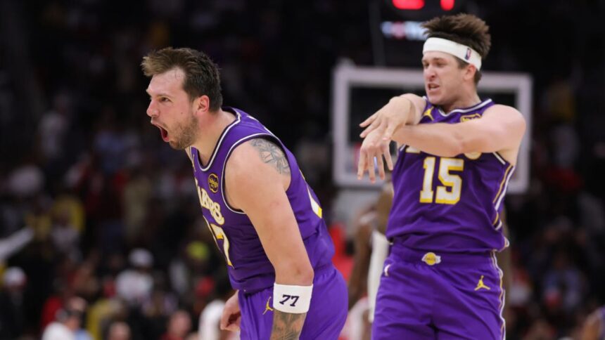HOUSTON, TEXAS - MARCH 18: Austin Reaves #15 of the Los Angeles Lakers celebrates with Luka Doncic #77 of the Los Angeles Lakers during the second half against the Houston Rockets at Toyota Center on March 18, 2026 in Houston, Texas. (Photo by Alex Slitz/Getty Images)