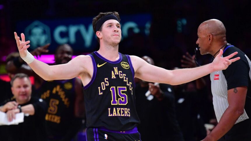 Mar 10, 2026; Los Angeles, California, USA; Los Angeles Lakers guard Austin Reaves (15) reacts after scoring the three point basket and draws the foul against the Minnesota Timberwolves during the second half at Crypto.com Arena. Mandatory Credit: Gary A. Vasquez-Imagn Images