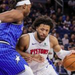 Mar 1, 2026; Orlando, Florida, USA; Detroit Pistons guard Cade Cunningham (2) drives against Orlando Magic center Wendell Carter Jr. (34) during the first quarter at Kia Center. Mandatory Credit: Mike Watters-Imagn Images