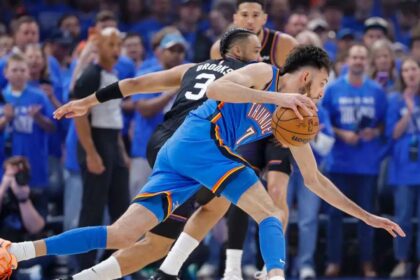 Apr 19, 2026; Oklahoma City, Oklahoma, USA; Oklahoma City Thunder center Chet Holmgren (7) drives around Phoenix Suns forward Dillon Brooks (3) in the first quarter during game one of the first round of the 2026 NBA Playoffs at Paycom Center. Mandatory Credit: Alonzo Adams-Imagn Images